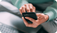 A therapist types on her mobile phone and wonders about the importance of 2FA or two factor authentication or two step verification for online security and HIPAA compliance