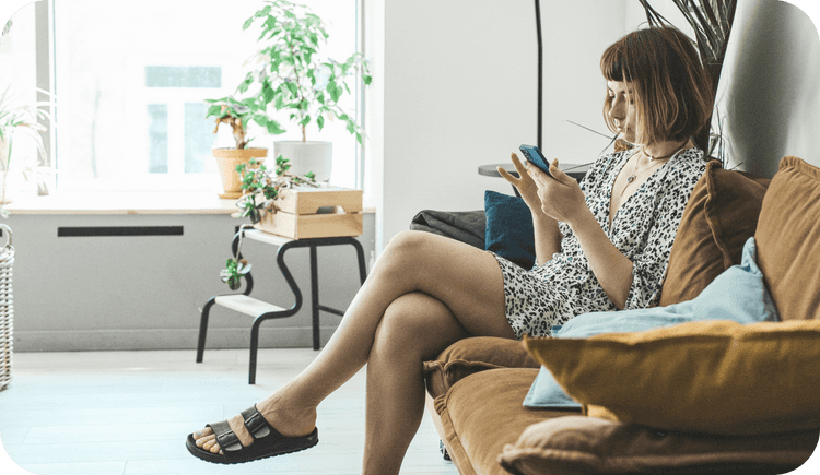 A female therapist sits in her office wondering why therapists need a no-show and cancellation policy