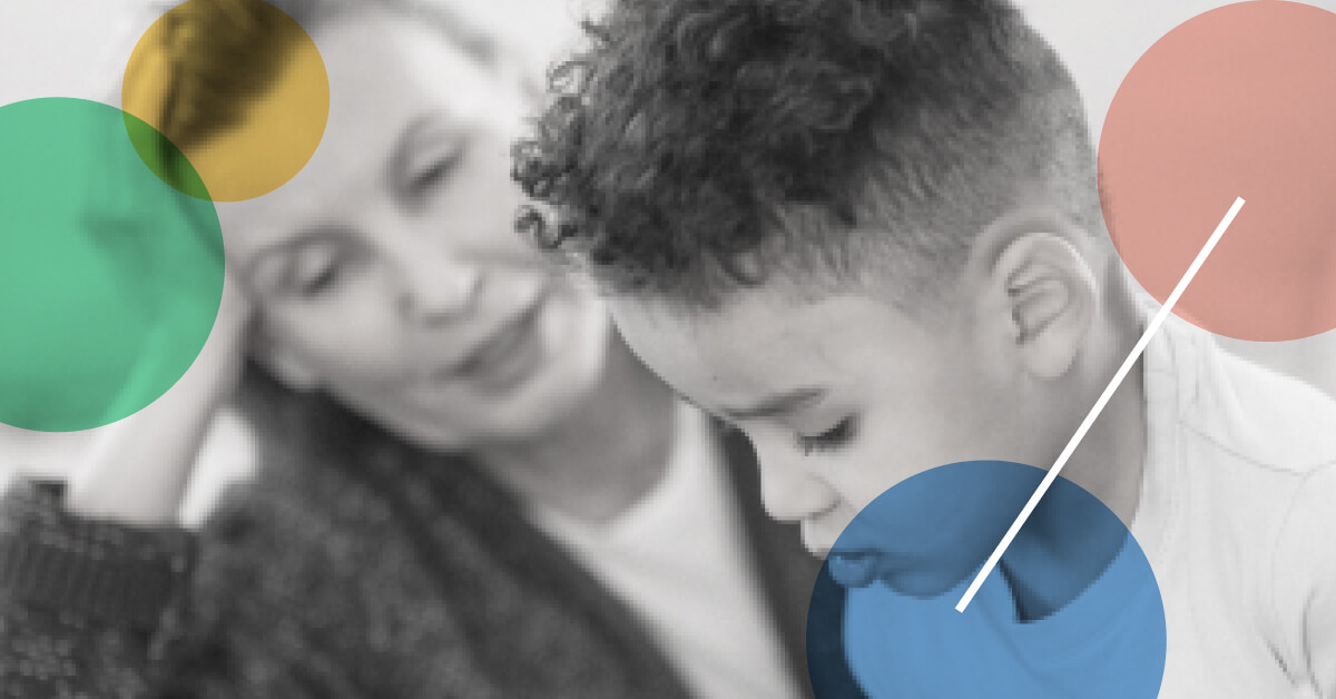 Black and white portrait of a child client and a therapist explaining to the child what does a pediatric occupational therapist do