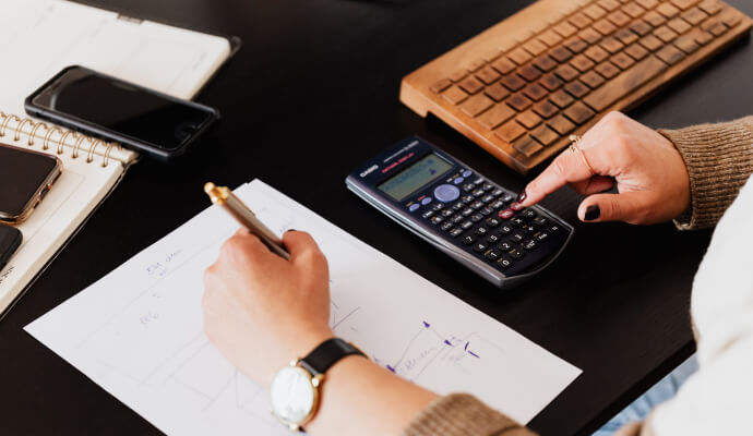 Therapist checks the budget for their practice to avoid bookkeeping mistakes