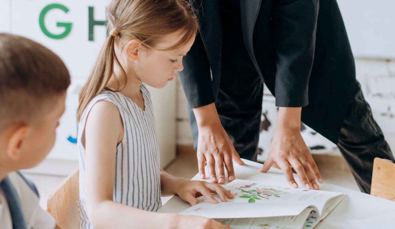 Speech language pathologist working with a child client, who has an articulation disorder.