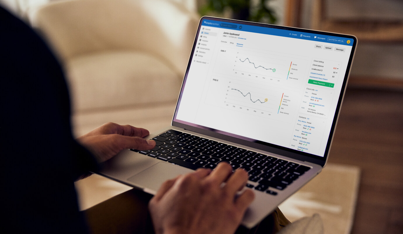 A clinician uses the integrated measurement-based care feature in SimplePractice, on their computer.